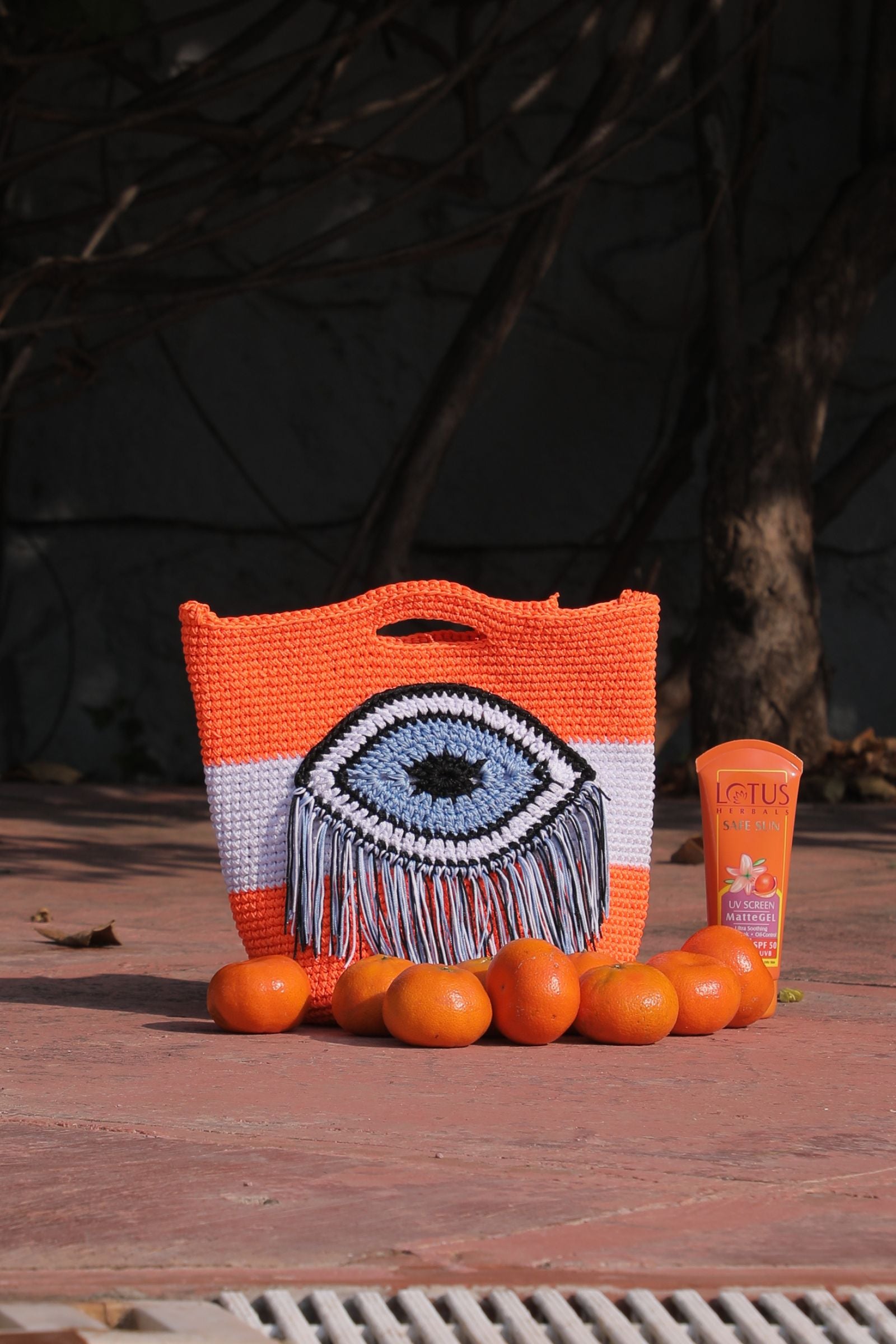 CANNA LILY EVIL EYE SLING